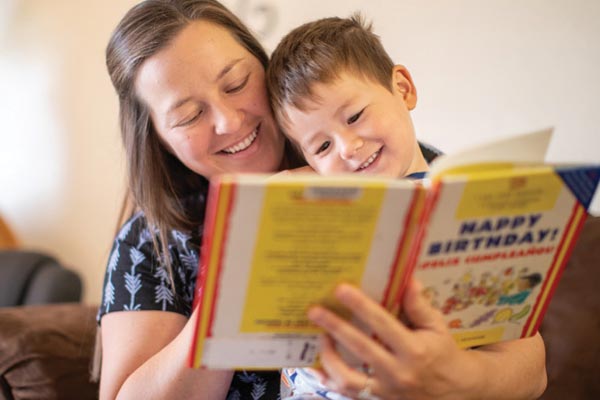 Gonzales Mom Reads With Child