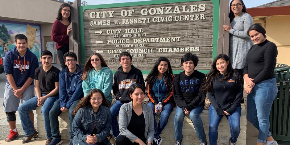 Gonzales Youth Council in front of the Gonzales City Hall Sign