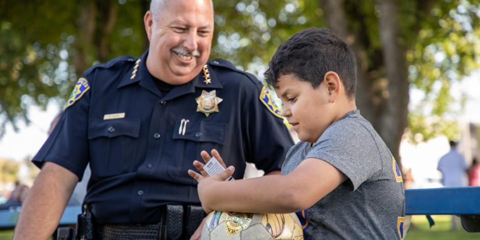 Gonzales Police Chief and child