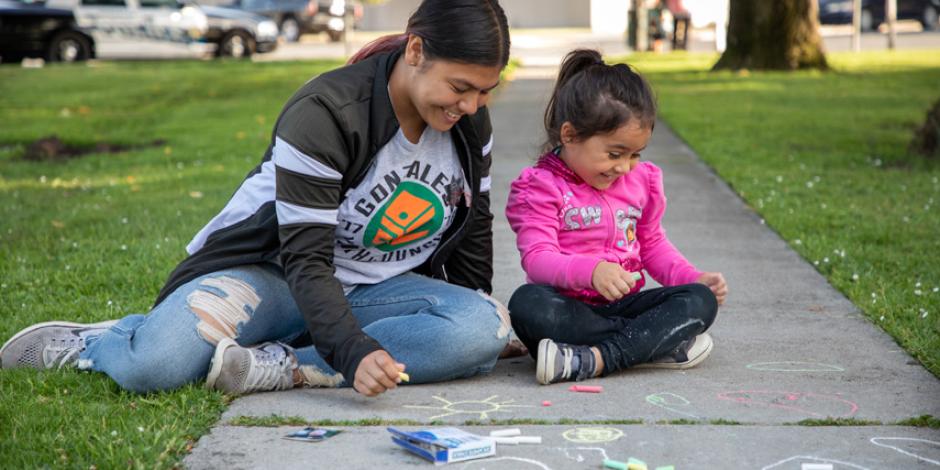 Gonzales family playing on sidewalk