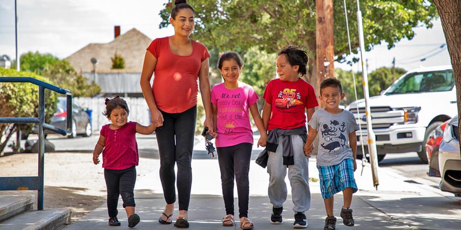 Young family walking near school