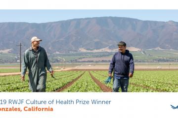 two people walking in a field in Gonzales